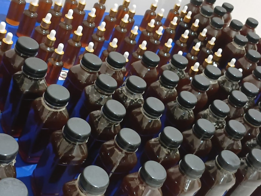 Afro Organic bottles freshly filled and lined up for inspection
